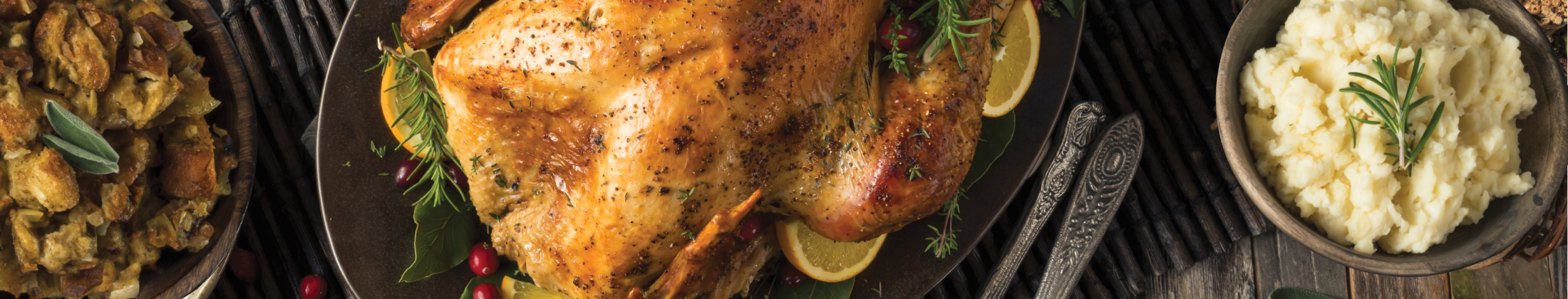 overhead shot of a Thanksgiving table with a turkey centerpiece